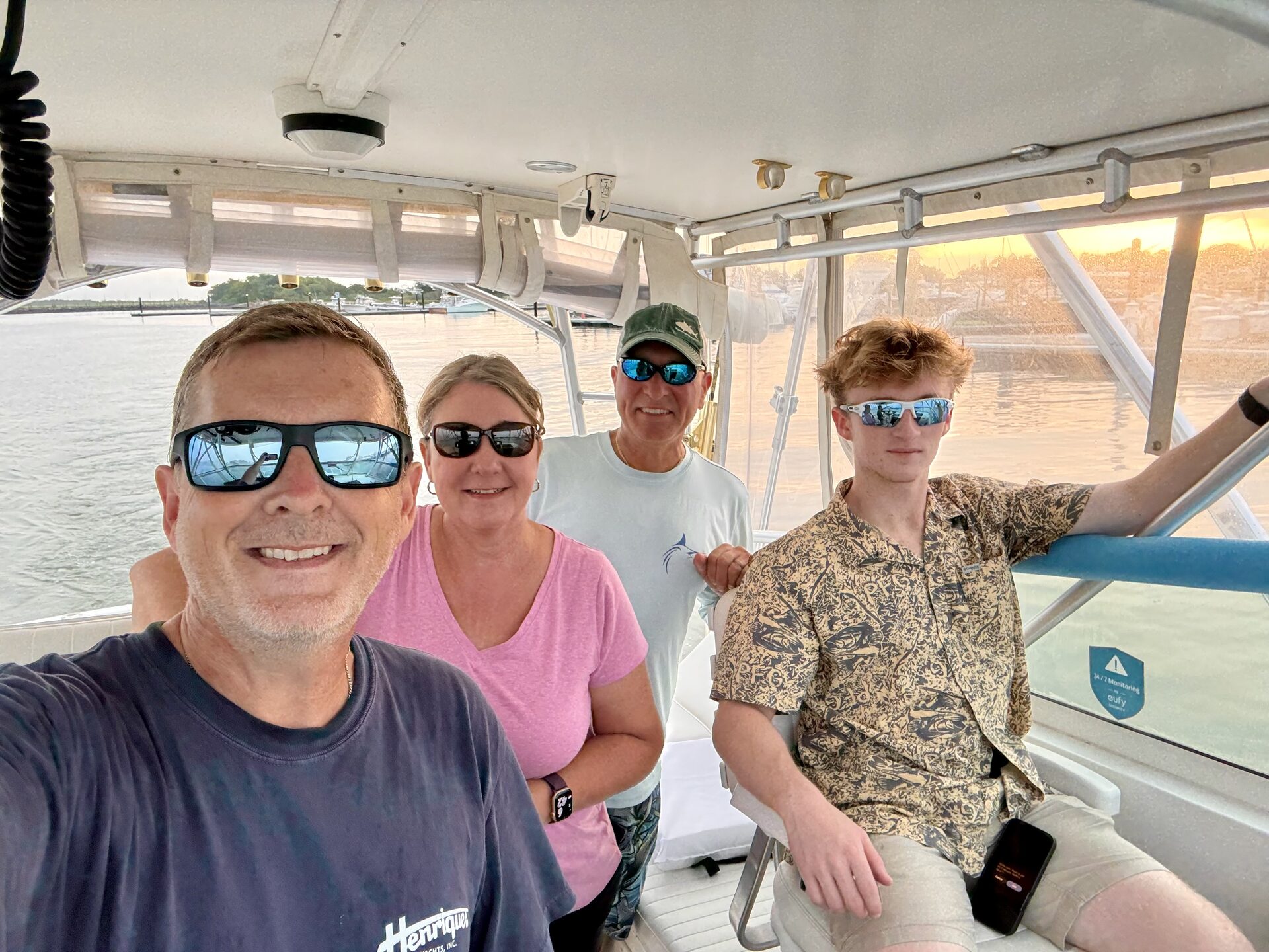 Happy group aboard at sunset
